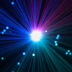 Vibrant light burst with colorful streaks and glowing orbs, representing innovative optical technolo.